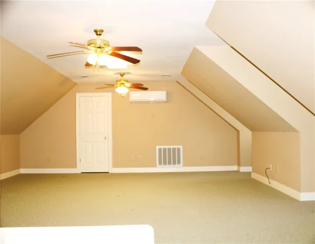This versatile attic space offers potential for a customized living area.