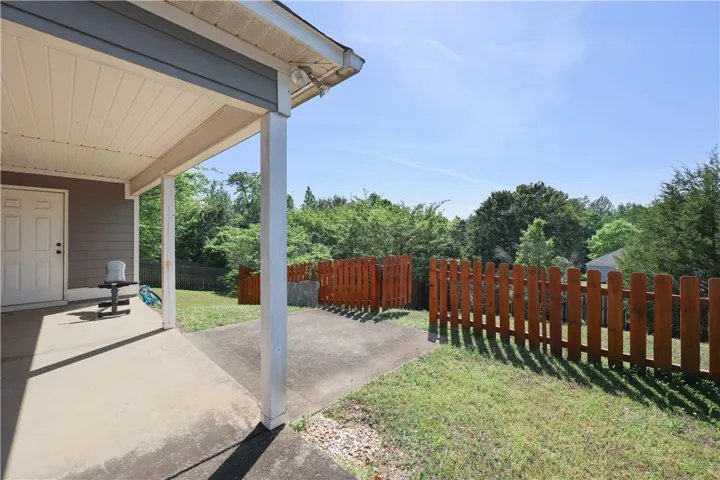 Private yard with wood fencing.