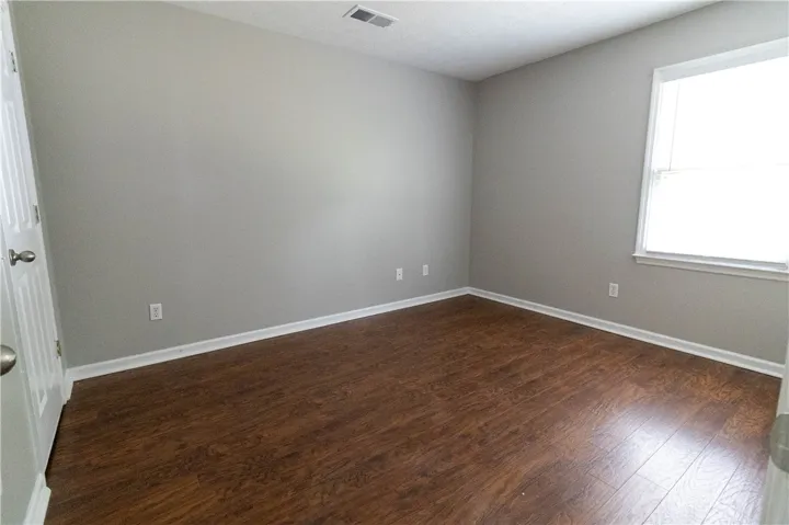 Primary bedroom, featuring a unique tray ceiling and private bath.