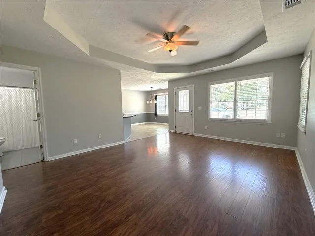 This inviting interior features elegant flooring and abundant natural light, perfect for comfortable living.