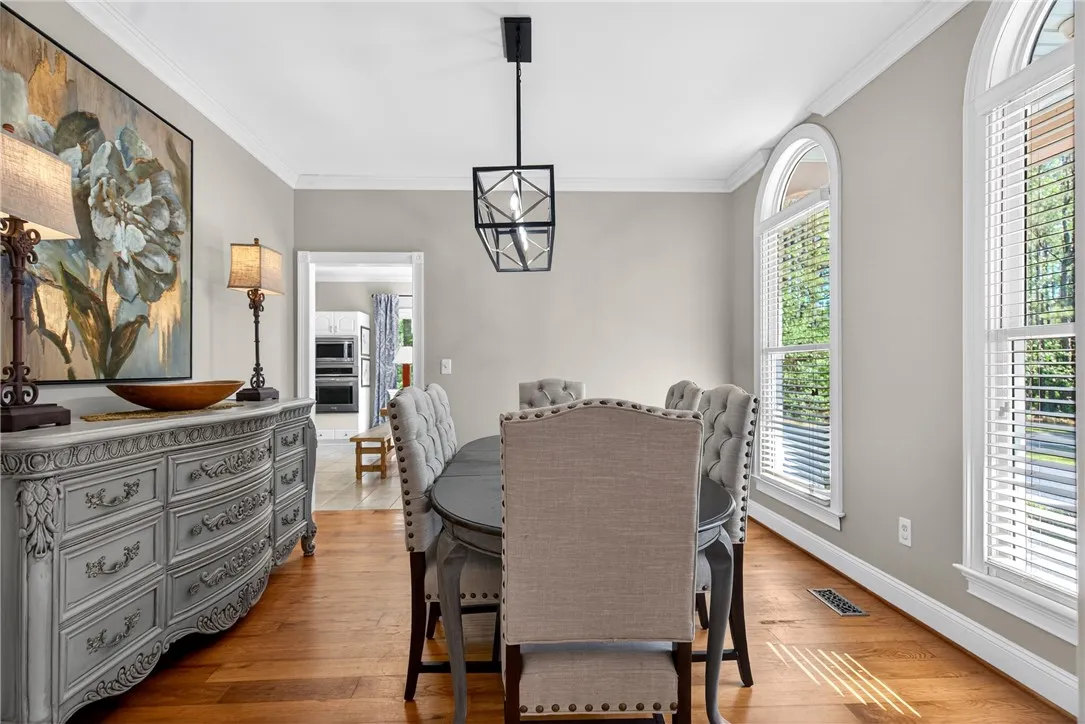 This dining room offers a warm ambiance, perfect for gatherings and everyday meals.