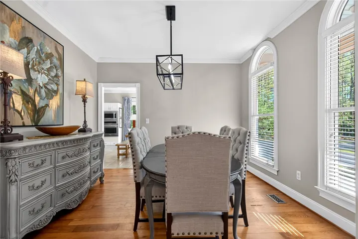 This dining room offers a warm ambiance, perfect for gatherings and everyday meals.