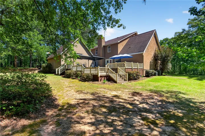 This home features a spacious deck, perfect for outdoor enjoyment and relaxation.