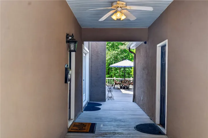 This inviting entryway leads to a spacious outdoor deck, perfect for relaxation or entertaining.