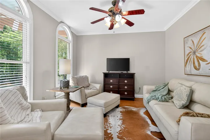 This inviting living room offers comfort and ample natural light, perfect for everyday relaxation.