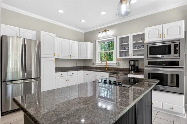 This bright kitchen features modern appliances and ample counter space.