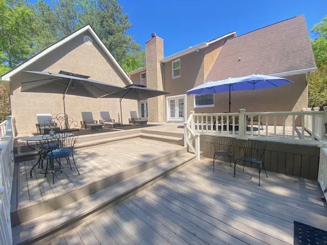 This spacious outdoor deck offers ample room for relaxation and entertaining.