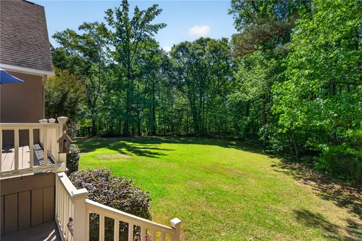 This expansive, private yard provides a serene natural retreat perfect for outdoor living.