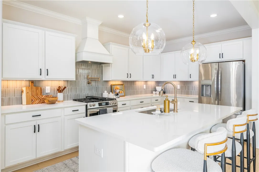 This image is of a previously built Azalea B model home, not the home for sale.