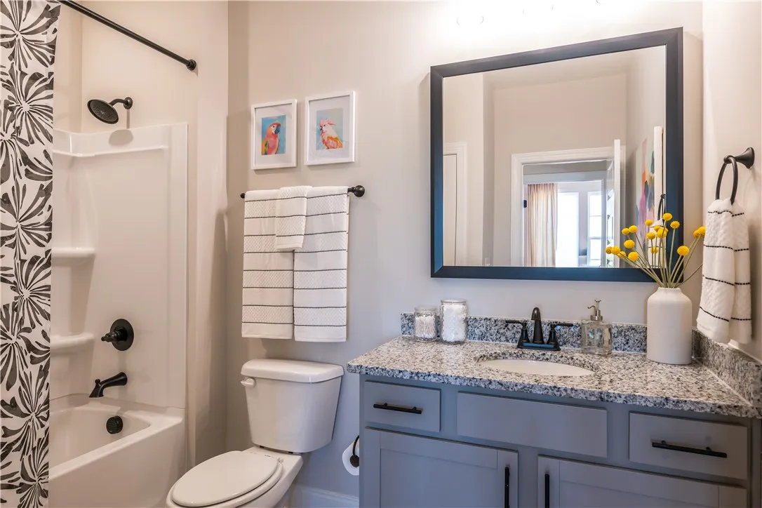 This image is of a previously built Azalea B model home, not the home for sale.