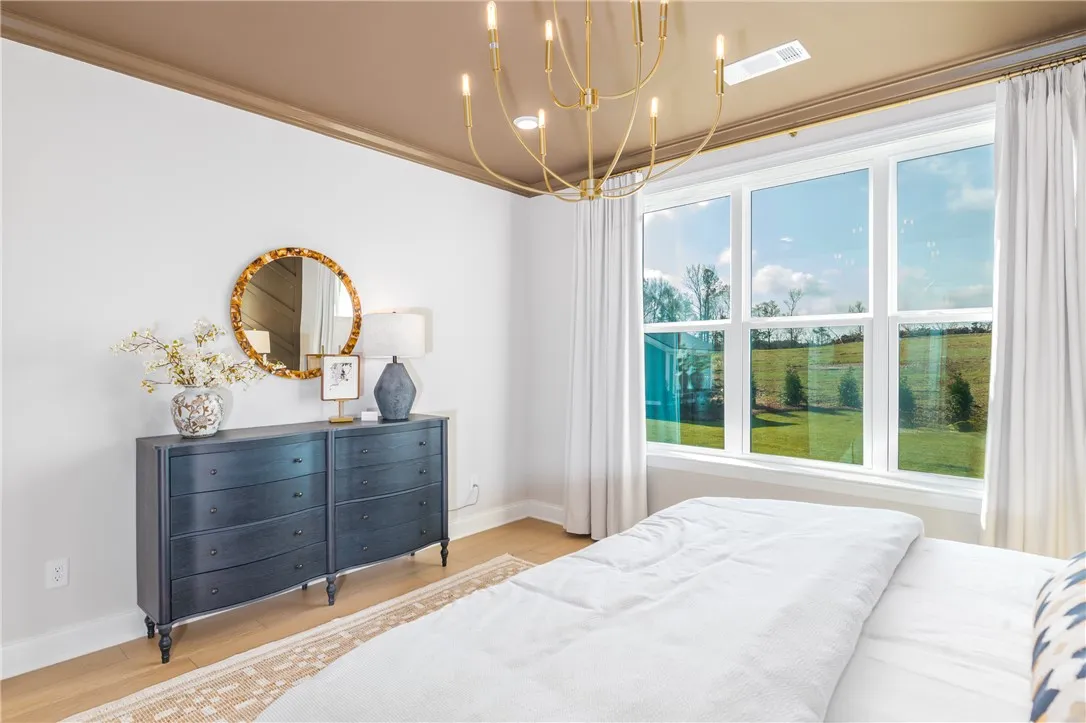 This image is of a previously built Azalea B model home, not the home for sale.