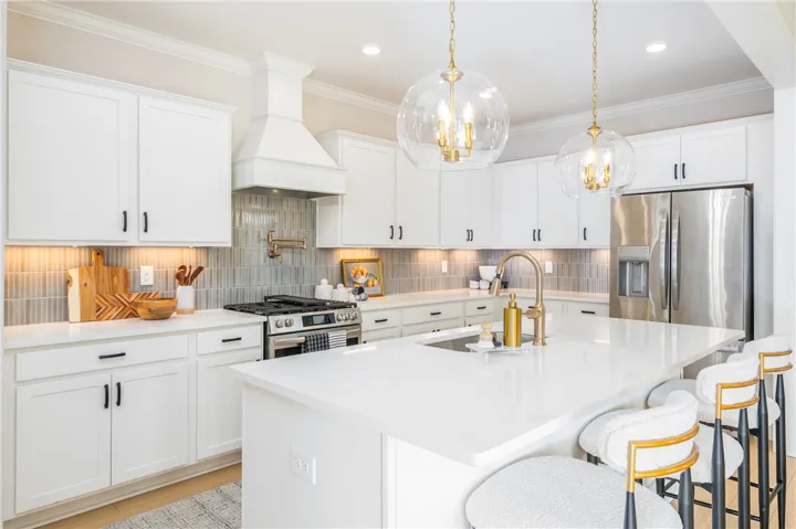 This image is of a previously built Azalea B model home, not the home for sale.