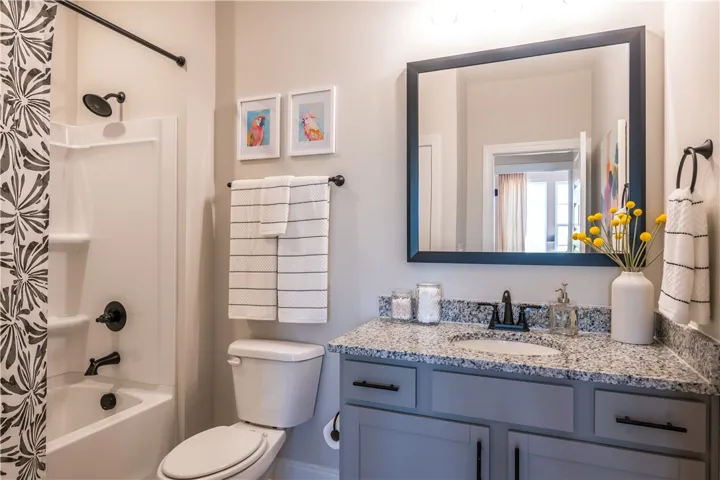 This image is of a previously built Azalea B model home, not the home for sale.