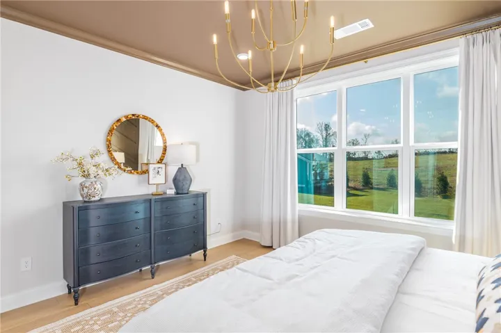 This image is of a previously built Azalea B model home, not the home for sale.