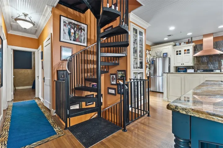Spiral staircase to the attic bonus space and also to the basement.