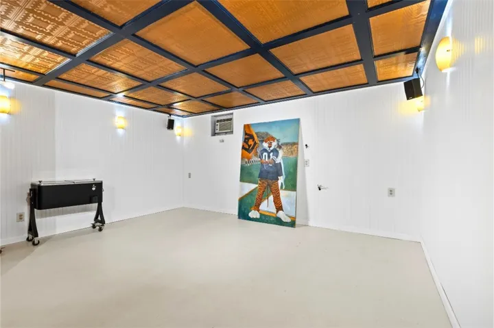 The basement offers a unique ceiling design and practical flooring.  Imagine a rec room, speakeasy or adding a murphy bed.  Accessible from the patio or the kitchen,