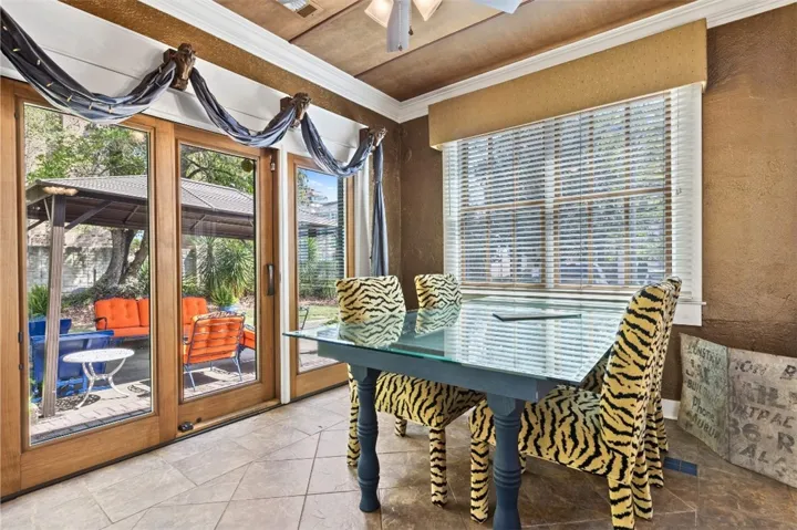 Light and bright dining area offers an inviting space for gatherings with easy access to outdoor living.