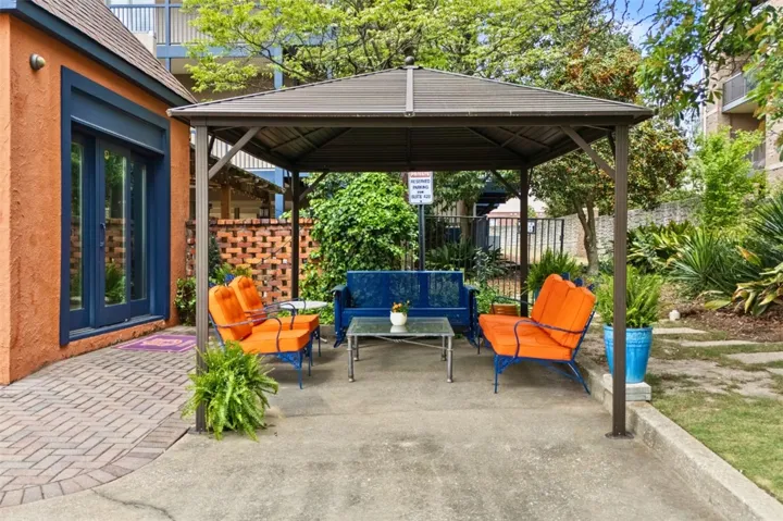 A covered pergola over one of the dedicated parking spaces  for extra tailgating room.