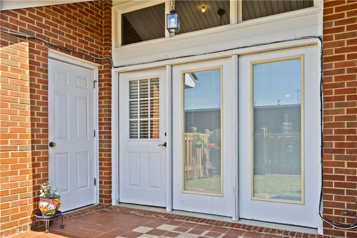 Covered patio space with more storage!  Perfect spot for tailgating and/or yard necessities!