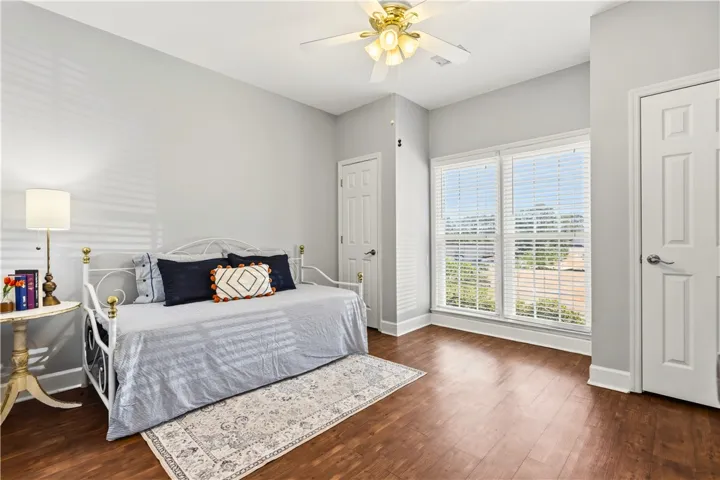 Downstairs bedroom w/vinyl-wood floors.  Good storage, sunlight & ensuite (also accessible to guests via the hallway)