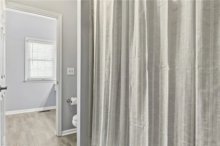 Tubshower & toilet separate from vanity space and connects to bonus.