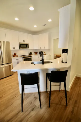 The breakfast bar allow for even more seating and/or serving options.
