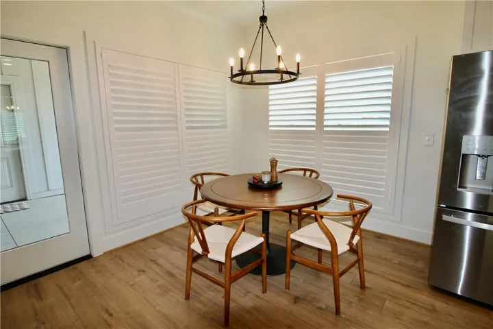 The breakfast area is flanked by two sets of double windows.  Have you noticed the plantation shutters throughout?  They are double hinged and give you lots of options regarding privacy and sunlight.  A VERY high end addition to this home.