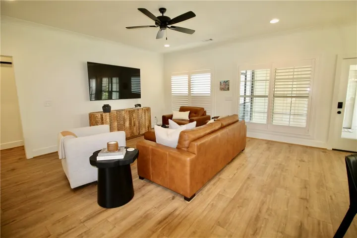 The room is spacious.  The great room windows look onto the screened porch and the private yard.