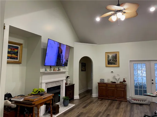 Living area with decorative fireplace that can be converted to gas