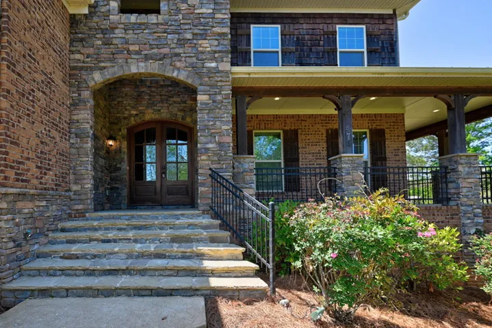 Walking up you'll find a beautiful wrap around front porch!