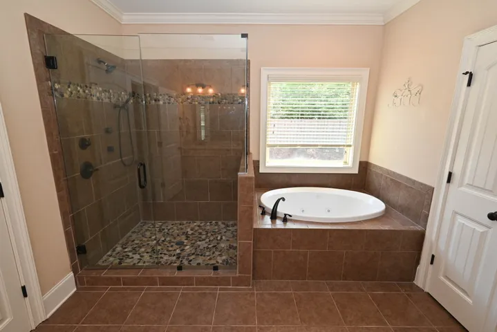 As well as a large tile/glass shower and jacuzzi tub.