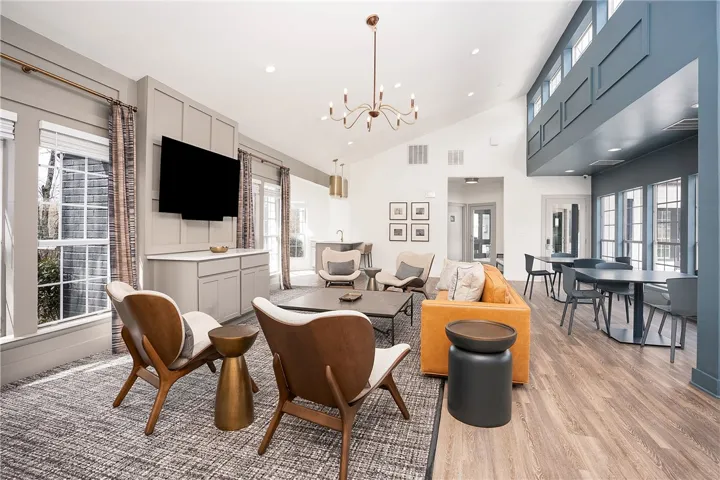 This communal space features soaring ceilings and abundant natural light, creating an inviting atmosphere.