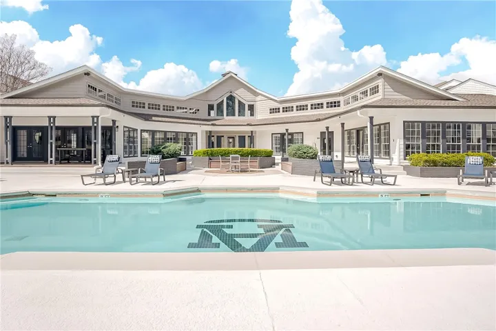 This exquisite property offers a private oasis with a sparkling pool, perfect for leisure and entertaining.