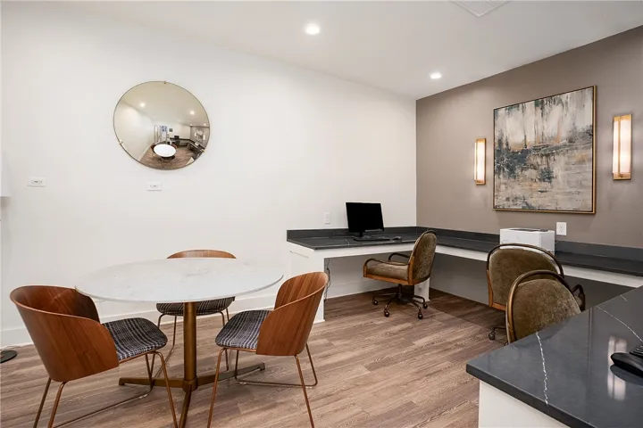 This workspace offers functional design with ample desk space and inviting seating.