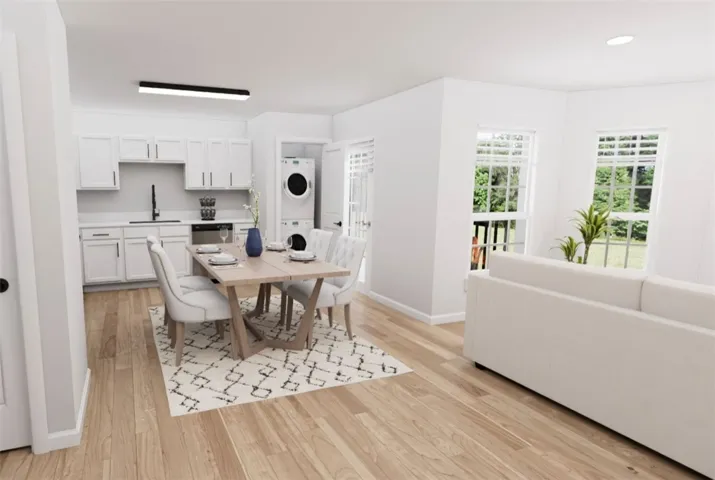Bright, open-concept living area featuring a modern kitchen, dining space, and comfortable lounge.