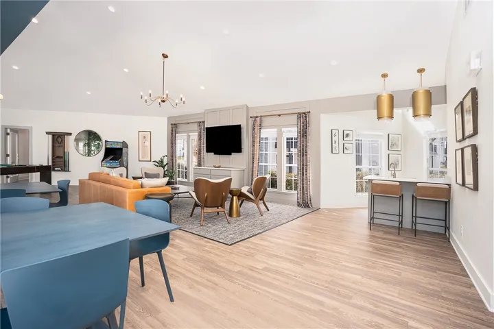 This expansive space features high ceilings, creating an airy and welcoming ambiance.