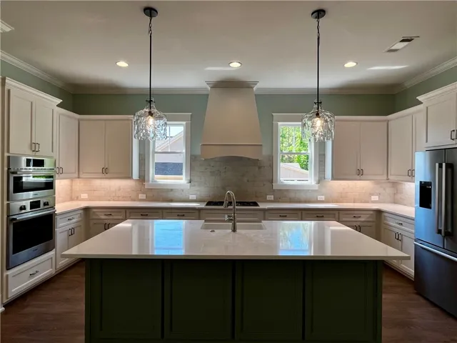 This spacious and bright kitchen offers ample counter space for culinary creativity.