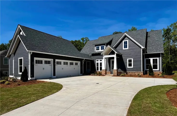 This newly constructed home features an attached 2.5 car garage.