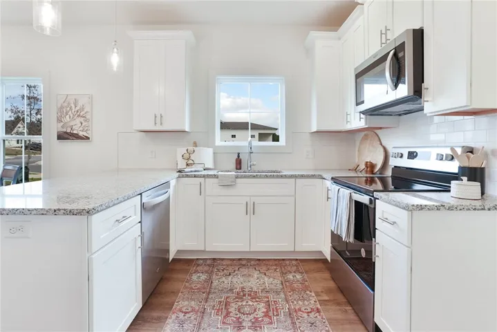 Photo is an example of a completed Camellia Duette. All plans, pricing and specifications are subject to change without notice.