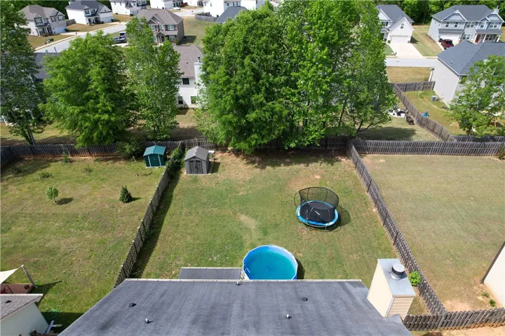 This spacious fenced yard offers ample room for outdoor activities and relaxation.