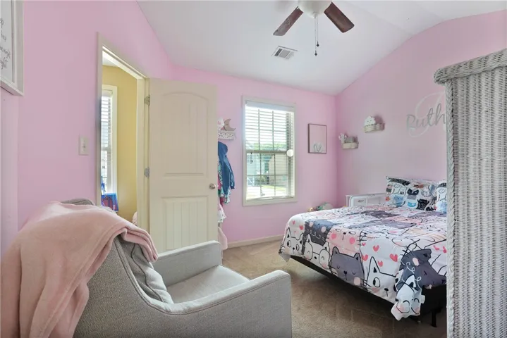 Bright and airy room with vaulted ceilings offers a comfortable retreat.