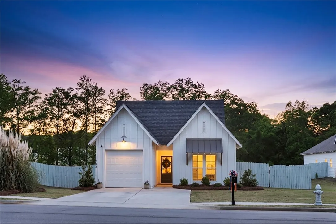 Board and batten siding creates a charming exterior for this thoughtfully designed residence.