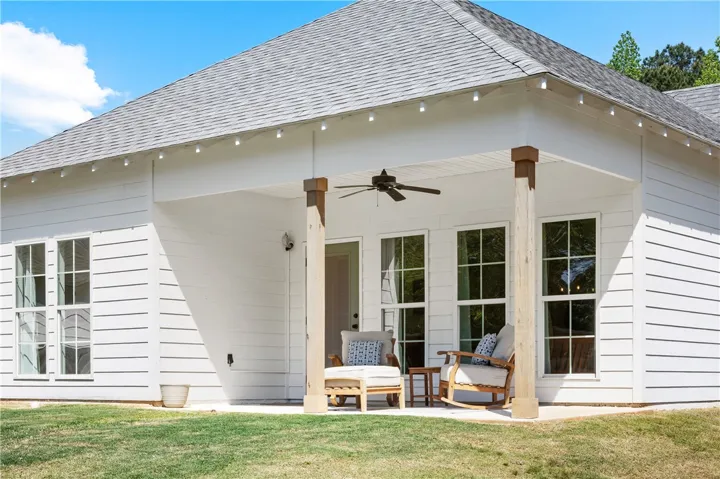 An inviting covered patio offers a relaxing outdoor living space.