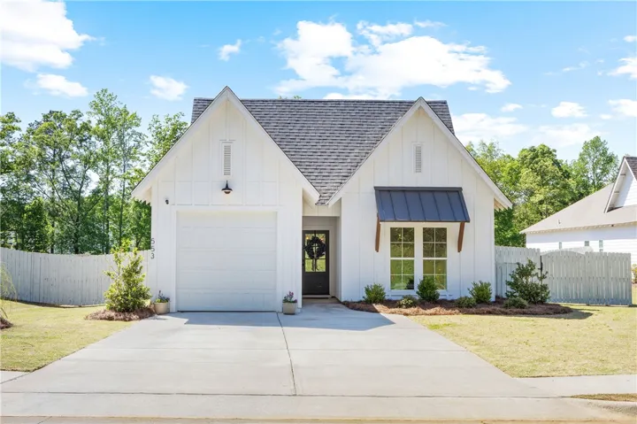 A well-maintained facade with a prominent garage and inviting entrance.