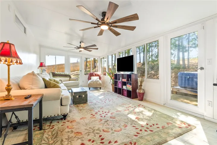 This bright sunroom offers abundant natural light and seamless indoor-outdoor living.