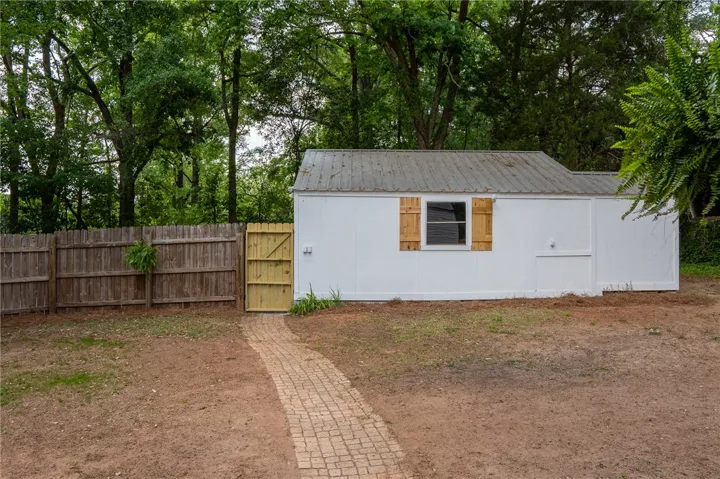This outdoor storage shed offers convenient organization for your gardening tools and more.
