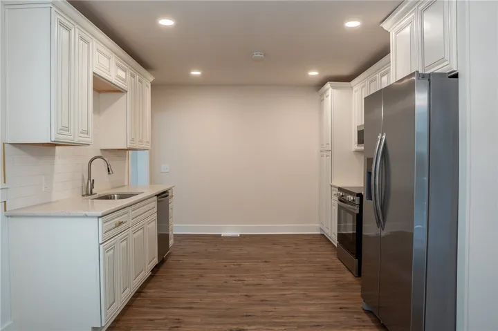 This functional kitchen features ample counter space and modern appliances, ready for your culinary adventures.