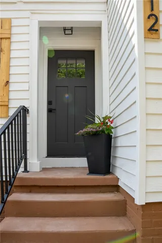 This charming entrance features a welcoming door and classic exterior details.