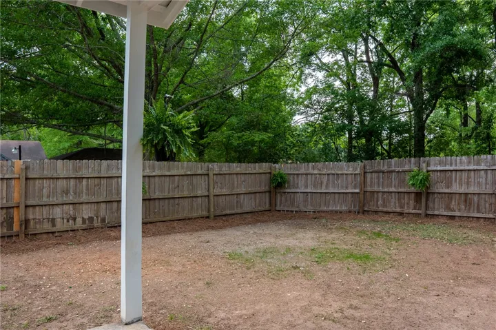 This spacious private yard is ready for your personal touch, offering an ideal outdoor retreat.