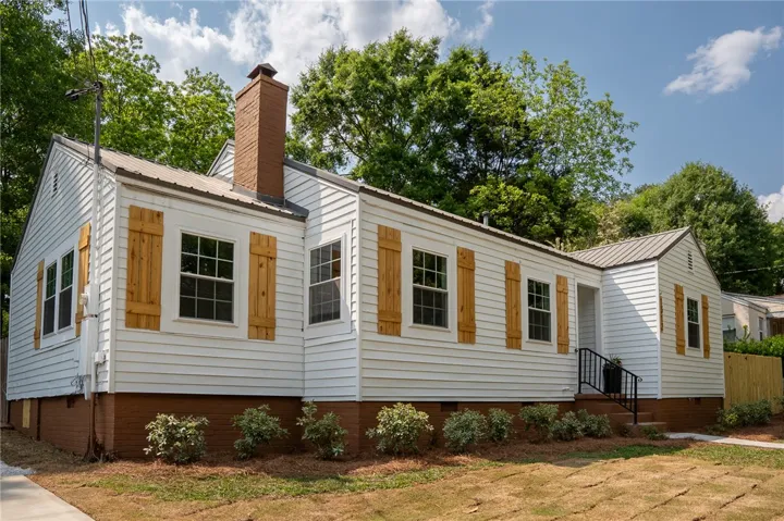 This captivating residence boasts a classic facade with thoughtful details and inviting curb appeal.
